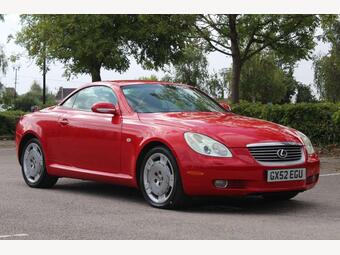 2002 FINISHED IN A CAPTIVATING SHADE OF RED, THIS EXQUISITE VEHICLE IS N... VIEW... photo