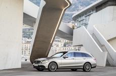 White Mercedes C Class estate parked in a modern building White Mercedes C Class estate parked in a modern building