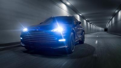 2022 Aston Martin DBX707 driving through a tunnel