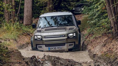 Land Rover Defender Land Rover Defender off-roading in mud