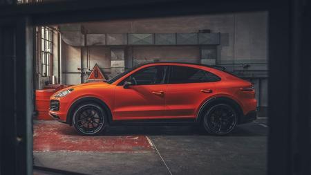 Porsche Cayenne Coupe Side view of the orange Porsche Cayenne Coupe