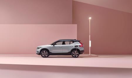 Silver Volvo XC40 electric car parked in a pink room