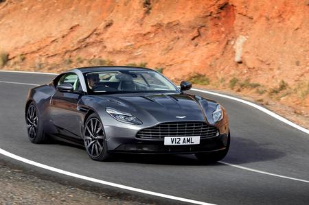 Aston Martin DB11 Black Aston Martin DB11 driving past orange cliffs