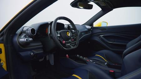 Ferrari F8 Spider interior Ferrari F8 Spider cabin, with Ferrari badge on the wheel