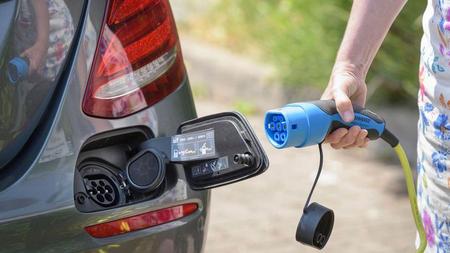 Charging an electric car Charging an electric car