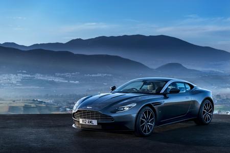 Aston Martin DB11 Aston Martin DB11 parked in front of a night sky