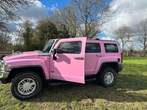 Pink customised Hummer H3 side