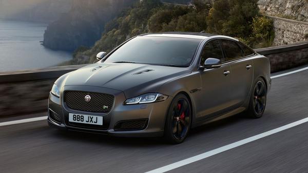 A silver Jaguar XJ on the road 