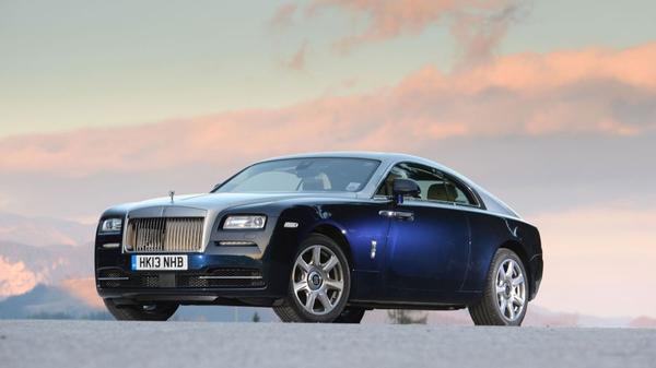 A blue Rolls-Royce Wraith on the road