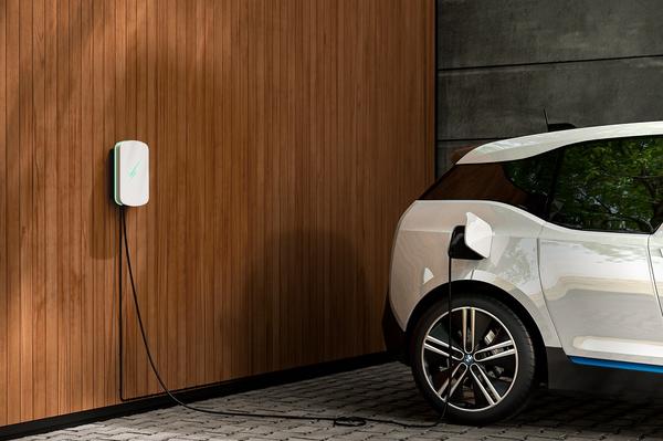 A Hypervolt home electric car charger charging white BMW i3