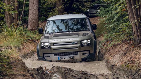 Land Rover Defender off-roading in mud