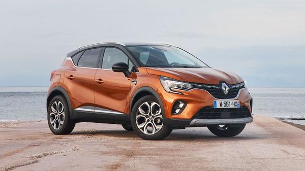 Orange Renault Captur parked near the coast