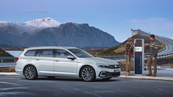 Volkswagen Passat Hybrid near a charger