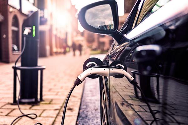 Electric car charging at charge point