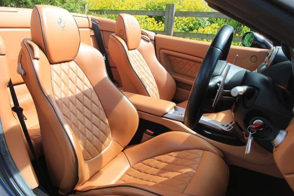 Ferrari interior with orange diamond stitched leather seats