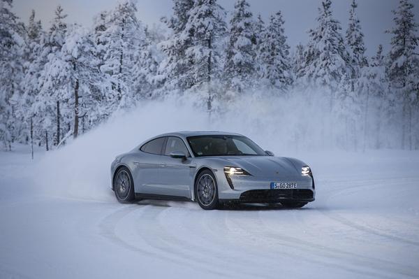 Porsche Taycan driving in snow