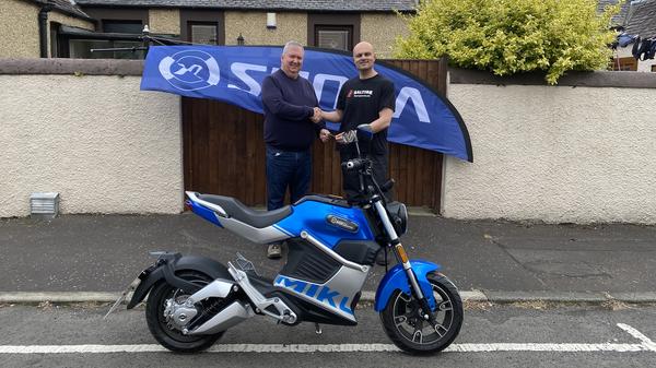 The winner Ian from Fife with Aimen from Saltire Motorcycles Edinburgh