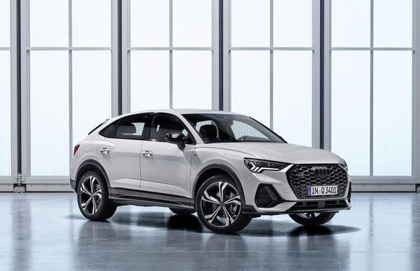White Audi Q3 Sportback SUV parked in a well-lit showroom