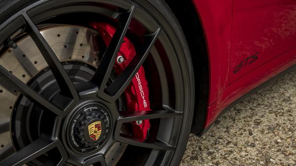 2022 Porsche 911 GTS in red detail of wheel, brake and badge