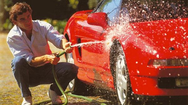 Senna washing his red Honda NSX