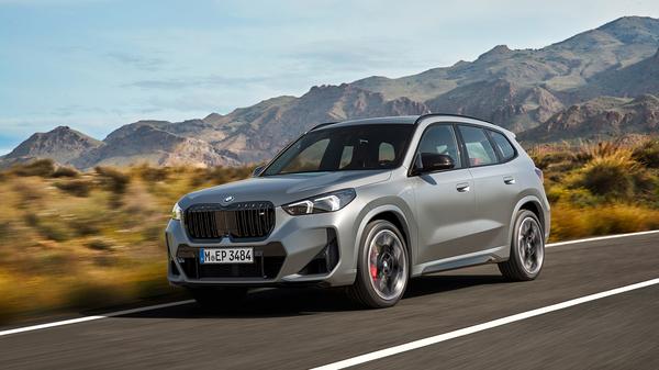 2023 Silver BMW X1 front driving