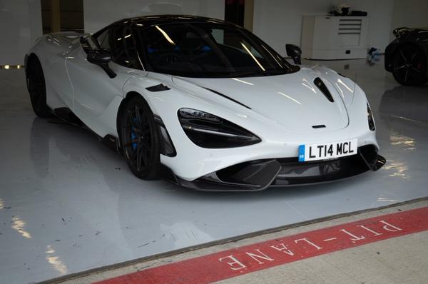 White McLaren 765LT parked in a garage