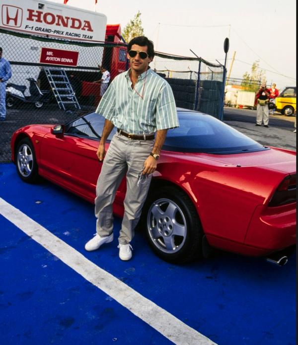 Senna posing with his red Honda NSX