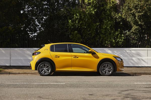 Yellow Peugeot e-208 side exterior view