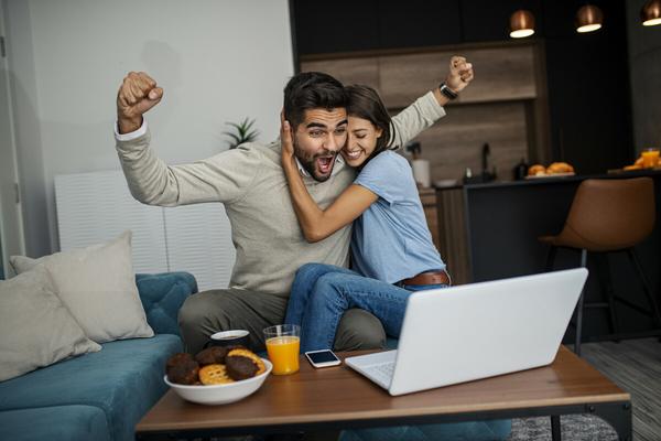 Couple celebrating a clean full vehicle history check