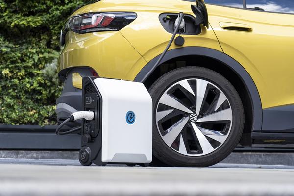 Yellow electric car using portable charger