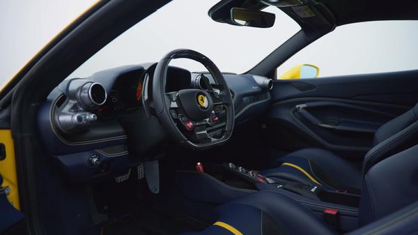 Ferrari F8 Spider cabin, with Ferrari badge on the wheel