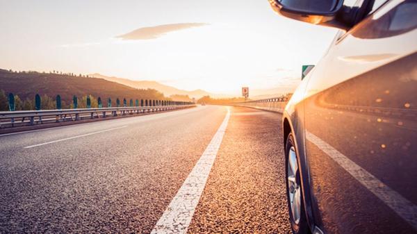 Car on a sunlit road