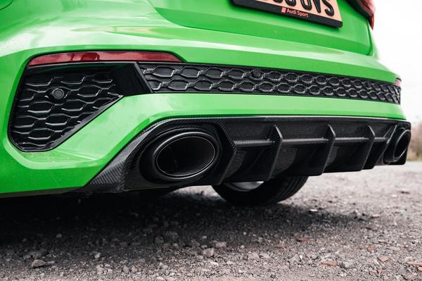 Close up of exhaust on green Audi RS3