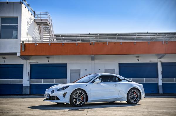 Alpine A110S outside a building