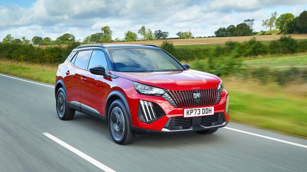 2023 Red Peugeot 2008 front driving