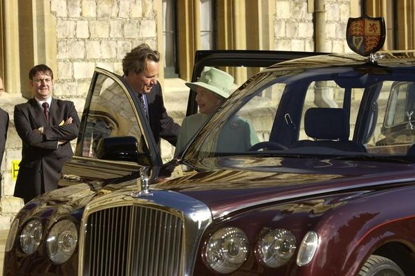 Queen Elizabeth entering her custom Bentley State Limousine