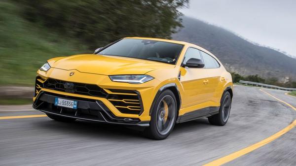 A yellow Lamborghini Urus