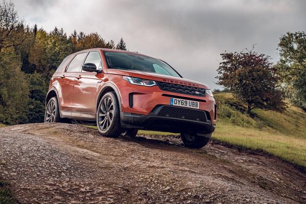 Orange Land Rover Discovery Sport preparing to go off-road