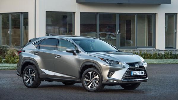 Silver Lexus NX300h hybrid parked on a drive