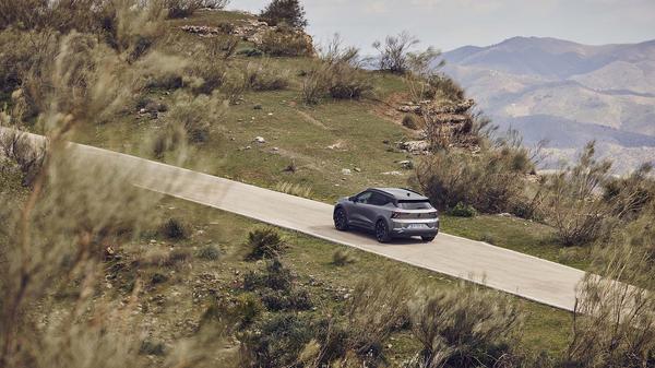 2024 Renault Scenic E-Tech driving up a hill 