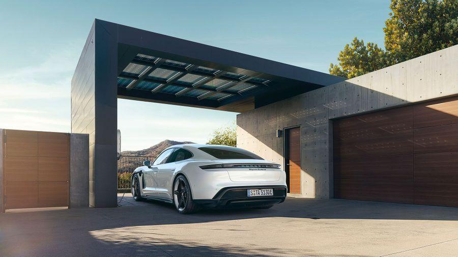 White Porsche Taycan electric car in a garage