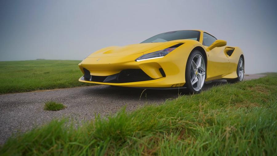 Ferrari F8 Spider Yellow Ferrari F8 Spider parked near green grass