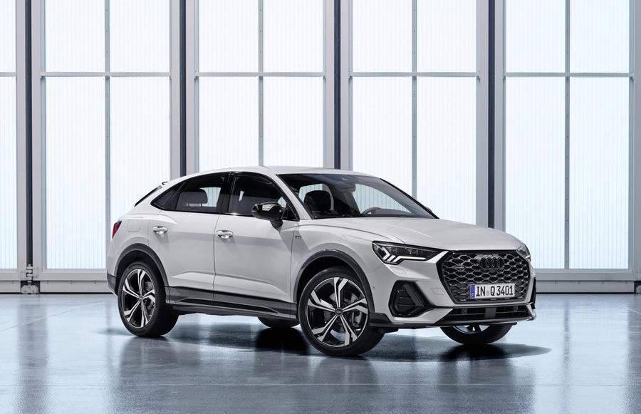 Audi Q3 Sportback White Audi Q3 Sportback SUV parked in a well-lit showroom