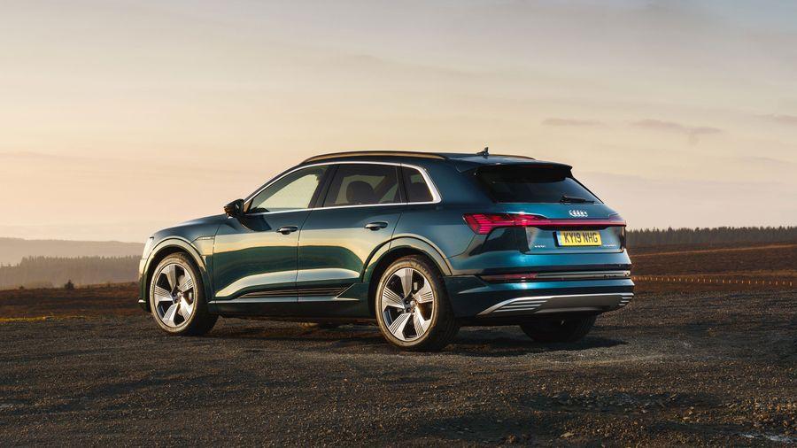 Audi e tron Audi e tron parked against a dusky sunset