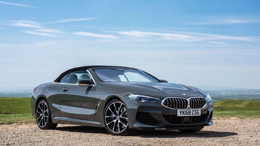 BMW 8 Series convertible BMW 8 Series convertible parked in front of a blue sky