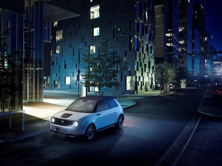 Honda E Concept art of a Honda E parked in a blue and green cityscape