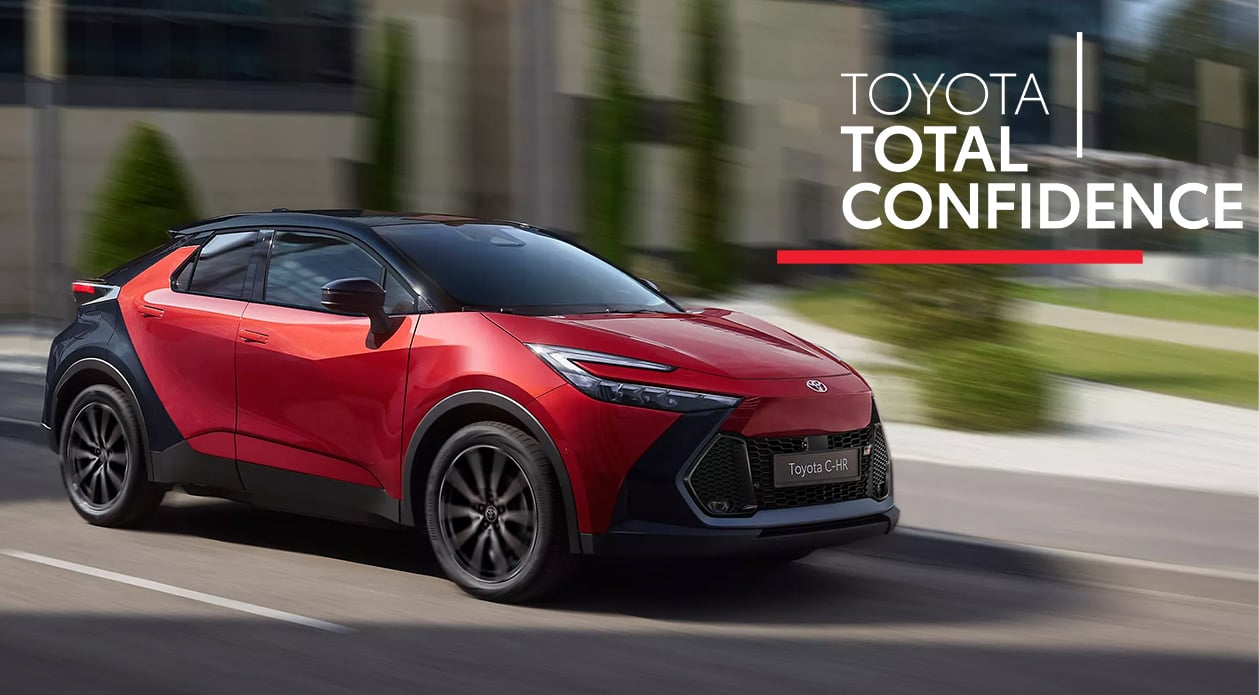 Women smiling and looking at a tablet