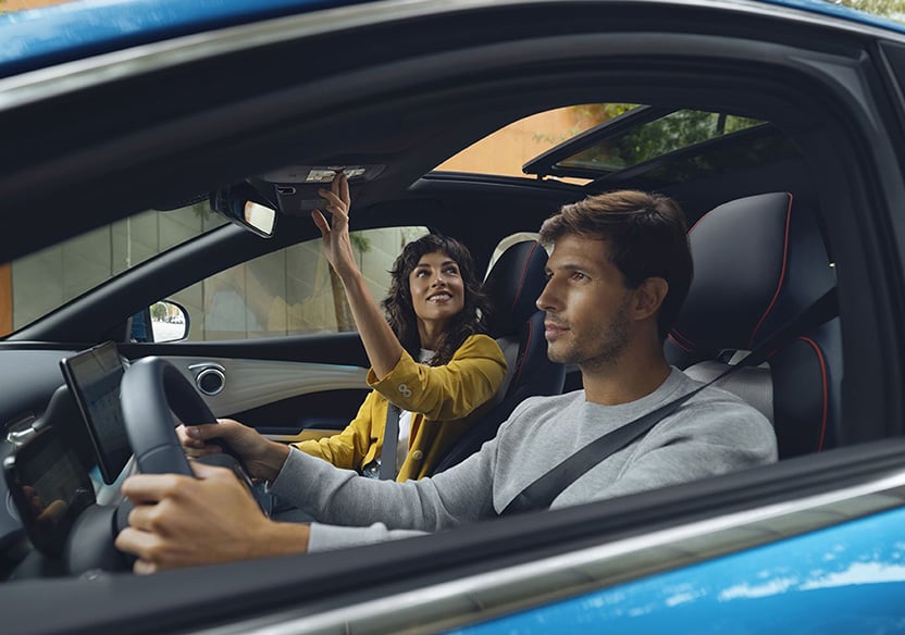 Women smiling and looking at a tablet