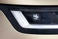 A close-up view of a Range Rover headlight