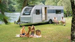 Adria Altea caravan parked on a campsite